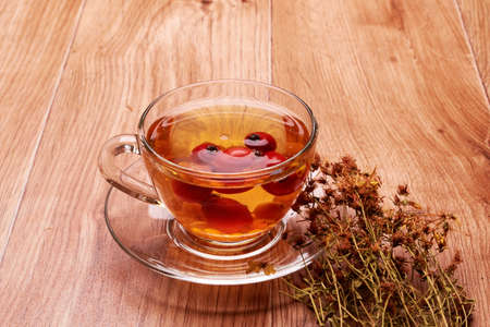 delicious drink in the Cup and plate round and with a beautiful, yellow bouquetの写真素材