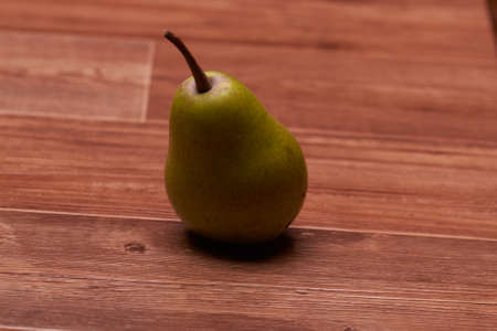 green one big fruit stands on a beautiful tableの写真素材