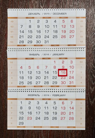 It marked the numbers on an annual, quarterly, big calendar, which is located on an old, vintage, brown, wooden floorの写真素材