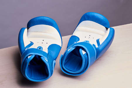 Blue boxing glovesの写真素材