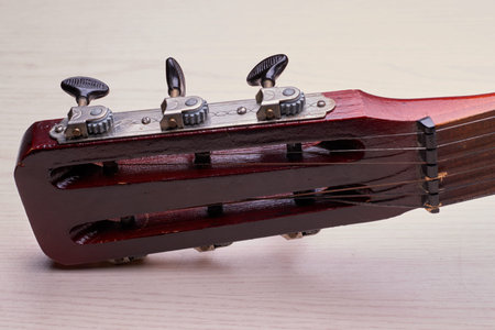 The front, working side of the fingerboard is flat or slightly convex