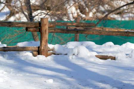 a round fence made of wood classic in the Parkの写真素材