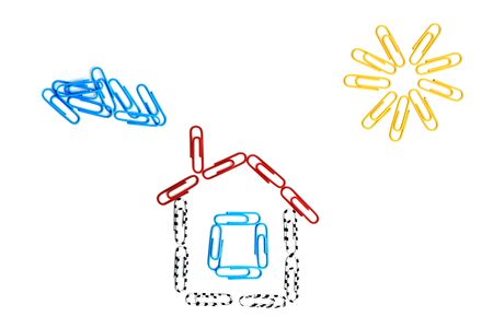 Paper clips house on the isolated backgrounの写真素材