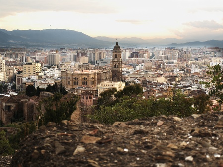 Panorama of the town of Malaga with the fortress wall. At the end of day.の写真素材