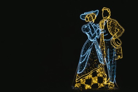 Christmas neon garlands in the form of peopleの写真素材