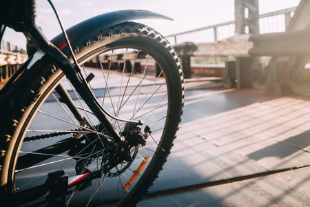 rear bicycle wheel with a wing in the sunの写真素材