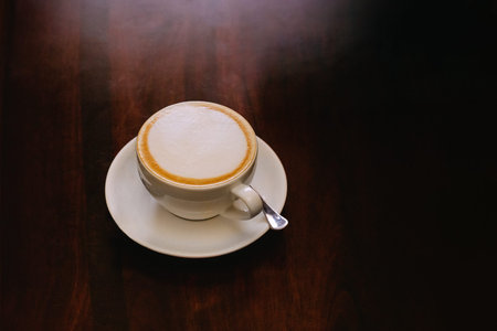A cup of cappuccino coffee in a white cupの写真素材