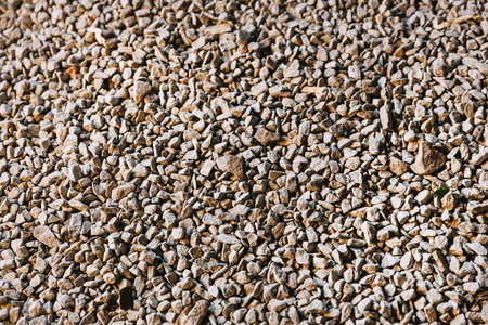 Crushed stone texture background. Macadam. Stone texture. Beautiful gravel background with gravel...