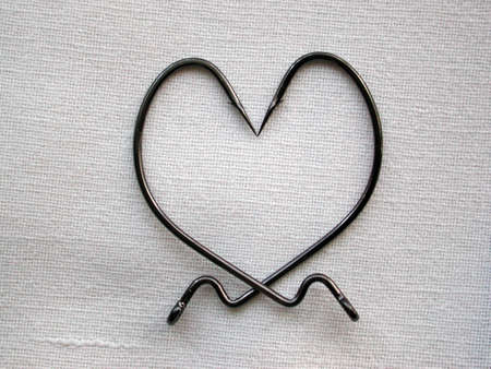 Bent hooks depicting heart  の写真素材