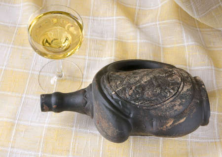 Old emply bottle and full crystal glassの写真素材