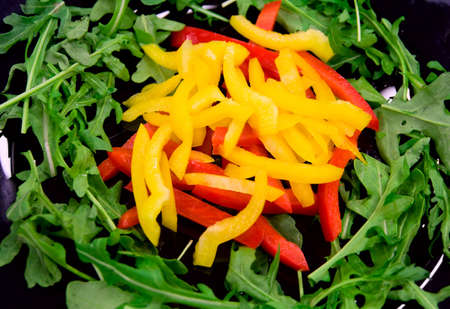 Salad with bell peppers and ruccolaの写真素材