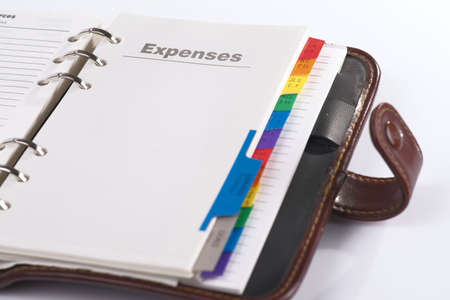 Open personal organizer with copy "expenses", close-upの写真素材
