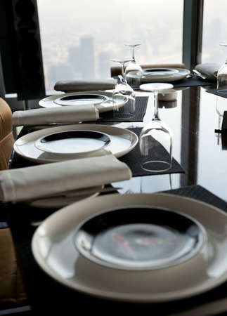 Expensive table arrangement in skyscraper restaurant, shallow focusの写真素材