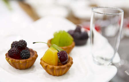 Tasty fruit dessert on plate in a restaurantの写真素材