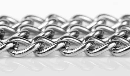 Stainless steel chains macro shot with shadow and reflectionの写真素材