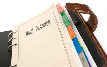 Daily planner, close-up shot on white backgroundの写真素材