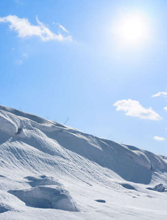 Clear winter sky and a lot of snowの写真素材