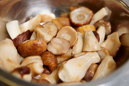 Mushrooms in stainless steel pot - healthy foodの写真素材