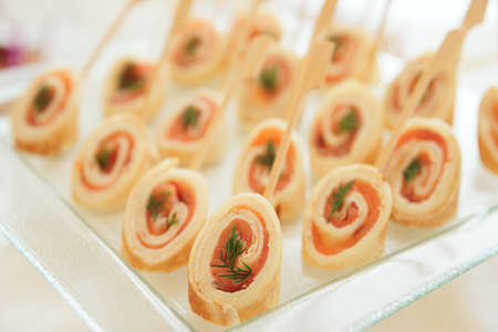 Rolled pancakes with smoked salmon, selective focusの写真素材