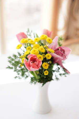 Boquet of orchids, tulips and daisies, very shallow depth of field, natural lightの写真素材
