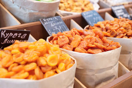 Dried apricots and another preserved food on street marketの写真素材