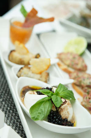 Plate with a creative fish tapas dishの写真素材