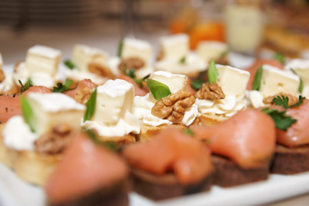 Various snacks in plate on banquet table