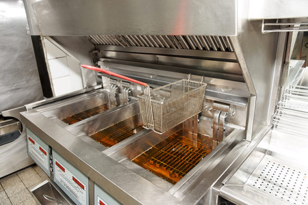 Deep fryer with oil on restaurant kitchen