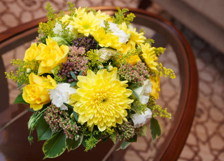 Flowers in a hotel room on coffee tableの写真素材