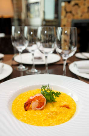 Risotto with shimp on arranged restaurant tableの写真素材