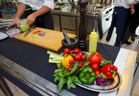 Work at the professional kitchen - fresh vegetables on table
