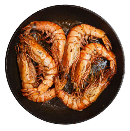 prawns being fried on pan, isolated on whiteの写真素材