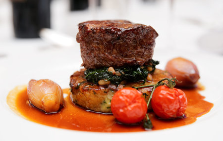 Tenderloin steak with spinach, sweet onions and cherry tomatoes