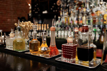 Bitters and various infusions on bar counterの写真素材