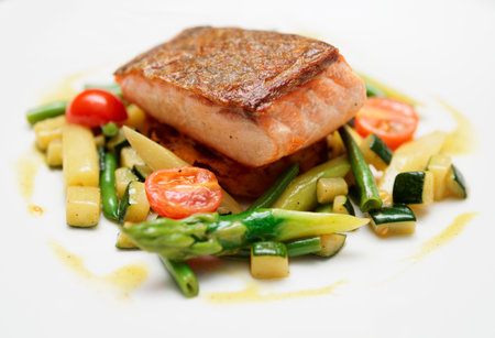 Salmon steak with vegetables close-upの写真素材