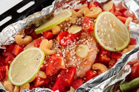 Chicken breast being cooked in asian style in ovenの写真素材