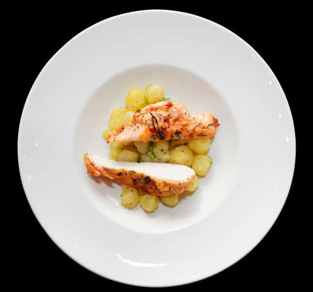 Chicken breast with potatoes on plate shot from aboveの写真素材