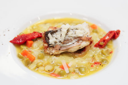 Seabass fillet with vegetable ragout in plate