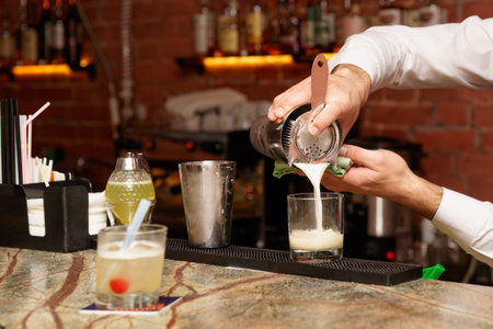 SONY DSCBartender is making cocktail at bar counter 