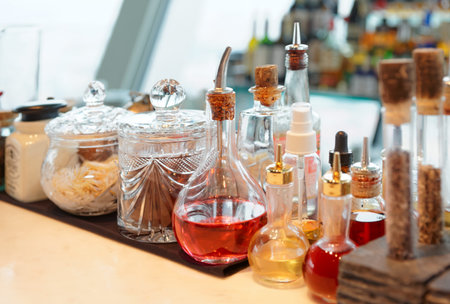 Bitters, spices and various infusions on bar counter 