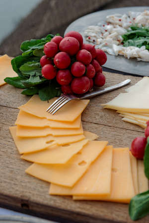 Simple food on table, vineyard scenere in backgroundの写真素材