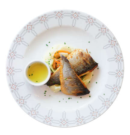 Grilled seabass fillet in plate, isolated on white background                  の写真素材
