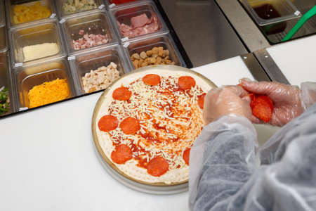 Pizza makers at commercial kithenの写真素材