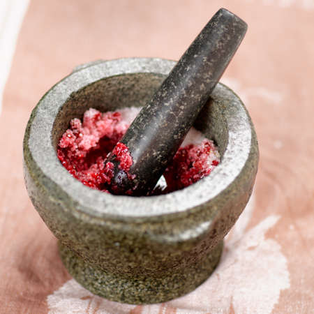 Salt and redberry marinade in granite mortarの写真素材