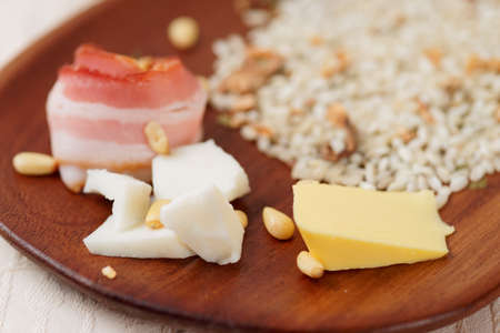 Risotto ingredients on wooden plate, shallow focusの写真素材