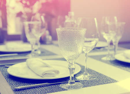 Nice place setting in an expensive restaurant, toned imageの写真素材