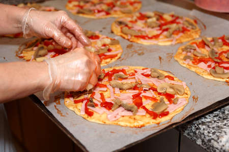 Making of cheap industrial pizzaの写真素材