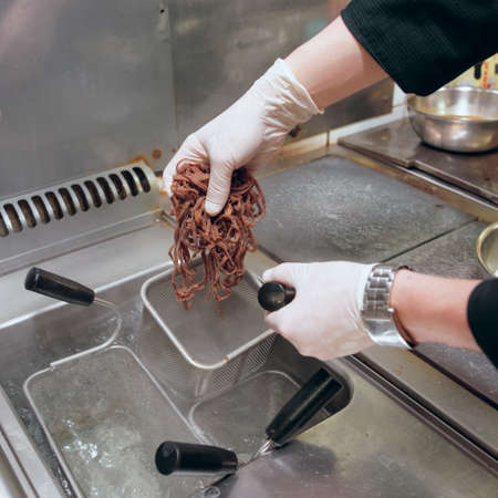 Chef is cooking rye pasta, commercial kitchen, toend imageの写真素材