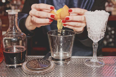 Bartender is adding egg white to the glass, tonedの写真素材