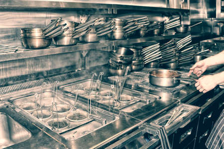 Typical kitchen of a restaurant shot in operation, toned imageの写真素材
